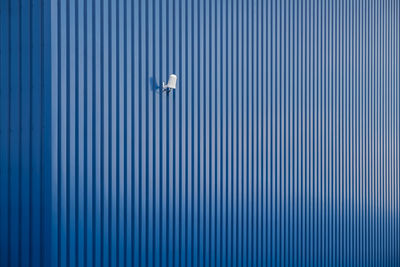 Lighting equipment on blue striped wall