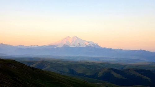 Scenic view of mountains against sky during sunset