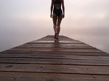 Woman standing against sky