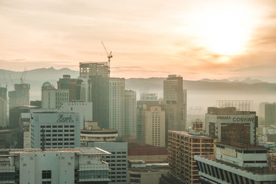 High angle view of buildings against sky during sunset