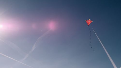 Low angle view of vapor trails in sky