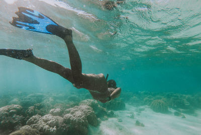 Woman swimming in sea