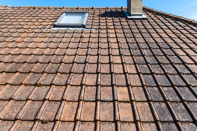 Low angle view of building roof against sky