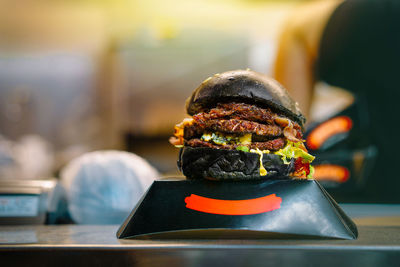 Black burger on display