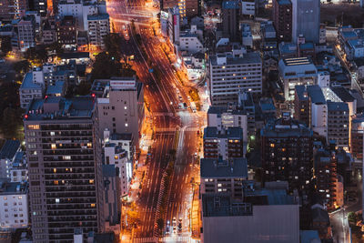 High angle view of illuminated cityscape at night