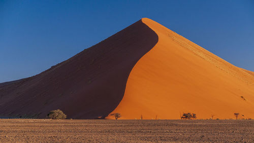 Scenic view of desert against clear sky