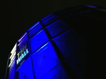 Low angle view of illuminated building at night