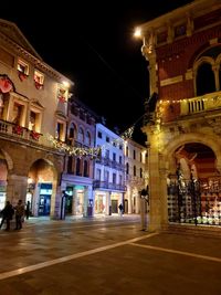 Illuminated buildings in city at night