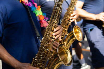 Musicians playing the saxophone are seen at the fuzue pre-carnival parade