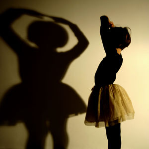 Girl standing against white background