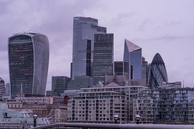 Modern buildings in city against sky