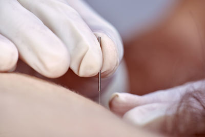 Close-up of woman holding hands