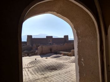 Buildings against clear sky seen through window