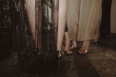 Fashion details of golden glittering dresses. fashion shot