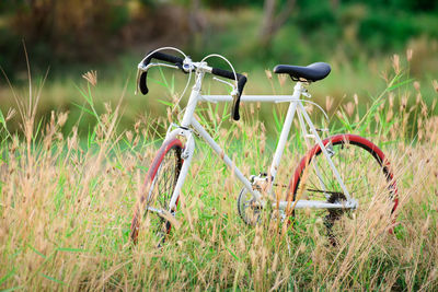 Close-up of bicycle on field