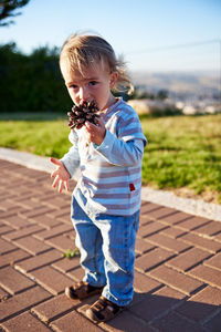 Boy standing on footpath
