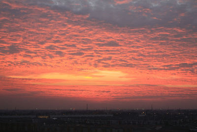 Dramatic sky over city during sunset
