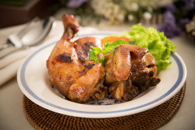 Close-up of chicken meat in plate at table