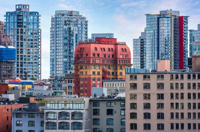 Buildings in city against sky