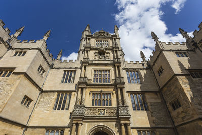 Low angle view of clock tower against sky