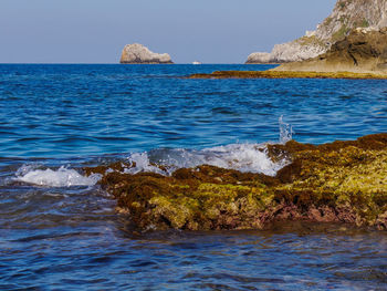 Scenic view of sea against blue sky