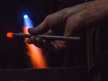 Close-up of hand holding cigarette