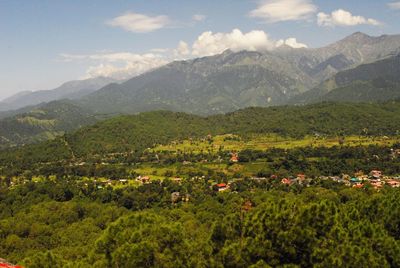 High angle view of green landscape against sky