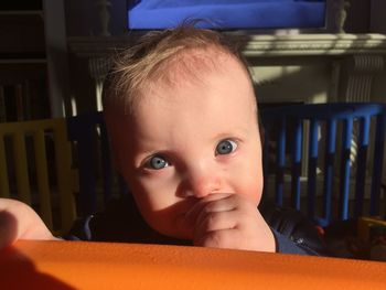 Close-up portrait of cute baby at home