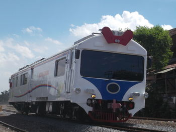 Train on railroad tracks against sky