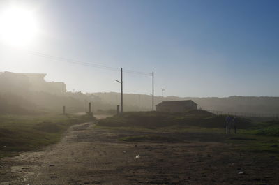 Scenic view of field against clear sky