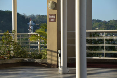 Text on railing against sky