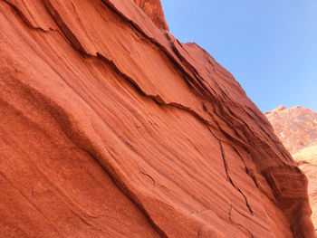 Low angle view of rock formation against sky