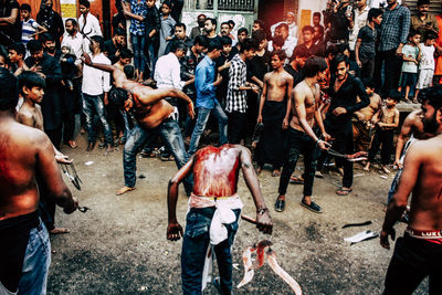 People standing on street in city