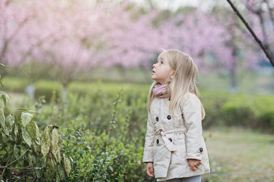 Young woman standing on field