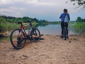 Full length of bicycle parked on land against sky