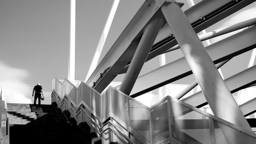 Low angle view of people walking on steps