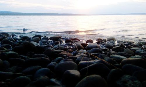 Scenic view of sea against sky at sunset