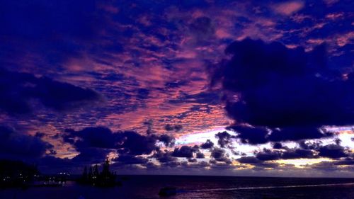 Scenic view of calm sea against cloudy sky
