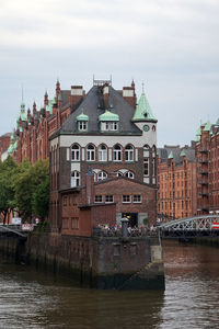 View from a bridge over the hamburg warehouse district. in the center there is a restaurant 