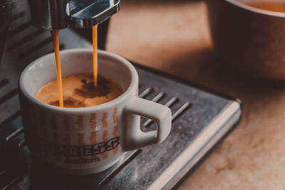 Close-up of coffee cup on table
