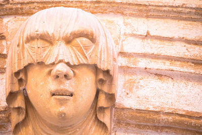 Close-up of statue against wall