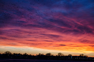 Scenic view of dramatic sky during sunset