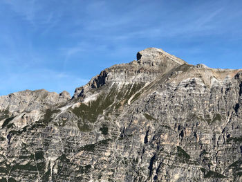 Low angle view of rock formation against sky