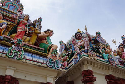 Low angle view of statue against sky