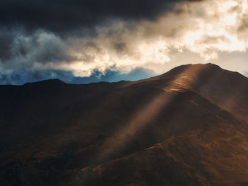 Scenic view of mountains against sky during sunset