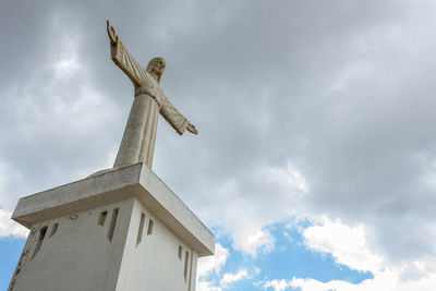 Low angle view of statue against sky