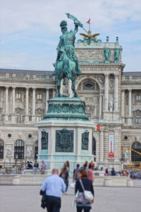 People in front of historic building