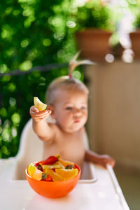 Boy sitting on table