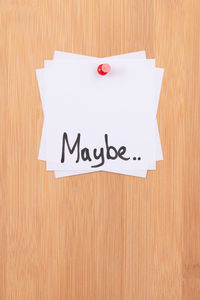 Close-up of text on wooden wall