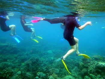 People swimming in sea